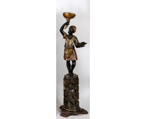 A carved wood blackamoor lamp, on stand, with gilt and painted decoration, 177 cm high  See illustration Condition report Rep
