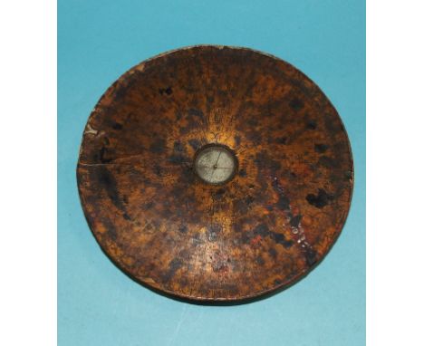 A late 19th/early 20th century Japanese lacquered compass, the gilt surround with divisions and Japanese characters, 14 cm di