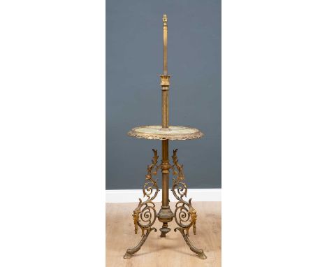 A gilt metal and onyx standard lamp/table with a scrolling tripod base and mask decoration, 160cm high x 54cm diameterConditi