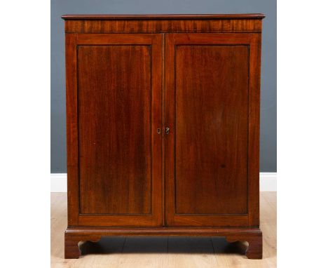 A 19th century mahogany side cabinet with twin panelled doors raised on bracket feet, 78cm wide x 33cm deep x 97cm highCondit