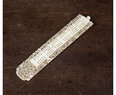 A 19th century Chinese carved ivory cribbage board with dragon decoration, 21.5cm in length x 4.4cm wideCondition report: in 