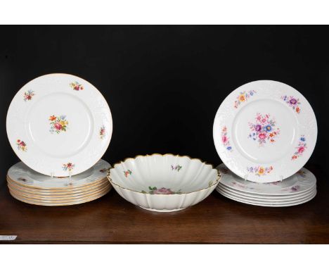 A German porcelain bowl  with a wavy gilded rim and hand painted floral decoration, 30cm diameter together with a set of eigh