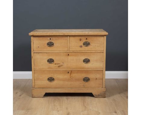 An antique pine chest of two short and three long drawers with later brass handles and raised on bracket feet, 94cm wide x 45