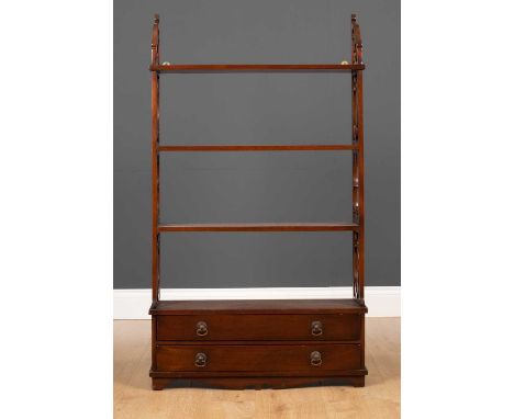 A Chippendale style mahogany hanging wall shelf with pierced fretwork sides, the shelves over two long drawers, 64cm wide x 1