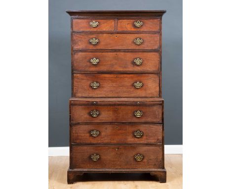 A George III mahogany chest on chest or tall boy with brushing slide and standing on bracket feet, 103cm wide x 57.5cm deep x