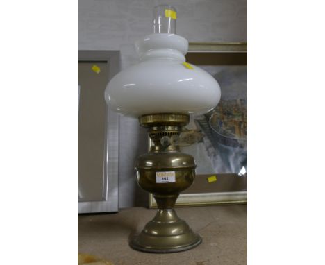 Brass oil lamp with white shade 