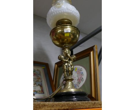 Oil lamp with brass figural base and white glass shade, 68 cm high 