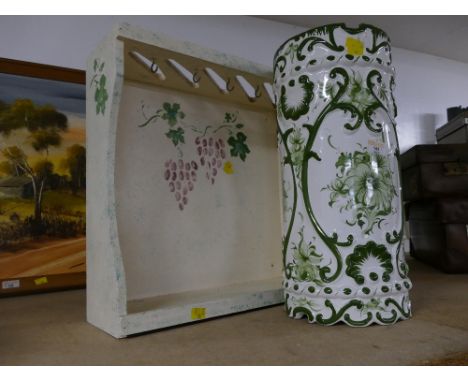 Green and white floral ceramic stick stand, height 46 cm, and wooden wall mounted hanging rack decorated with grapes and vine