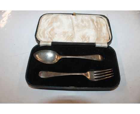 A cased silver fork and spoon, approx. total weight 50gms 