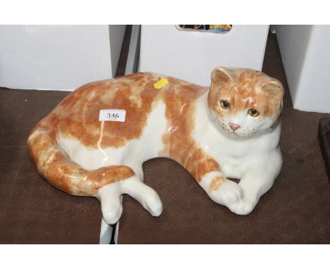 A Winstanley Pottery model of a recumbent ginger cat