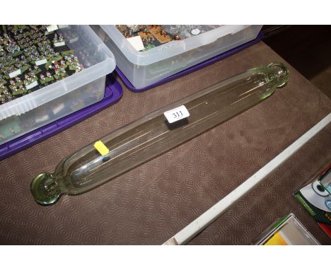 A 19th Century clear glass rolling pin with cut pontil ends