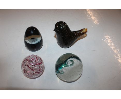 Four glass paperweights to include Langham Glass and Caithness