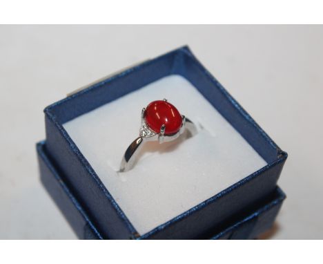 A Sterling silver Ethiopian red opal and white zircon ring, rings size L/M