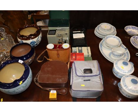 A pair of cased binoculars; a Minolta cine camera; various other vintage camera equipment etc.