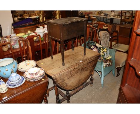 An oak gate leg dining table; a Lloyd loom chair and an early 20th Century sewing box