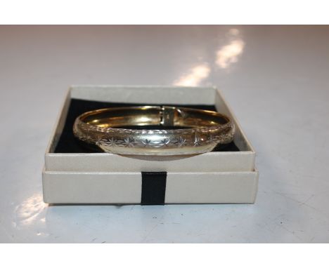 A Sterling silver continuous bangle with gilt washed interior 