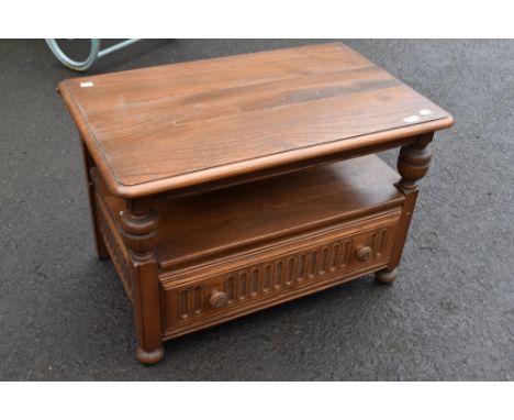 A 20th Century Ercol TV stand, with lift corner flap to rear, width approx. 73cm