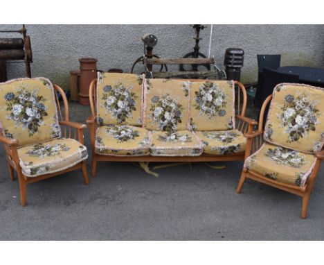 A vintage Ercol style three piece cottage suite in light stain