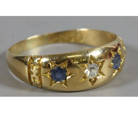 An 18ct gold gypsy ring set with diamonds and sapphires. Assayed Birmingham 1876, standard mark worn. 3.2 grams, Size O. 