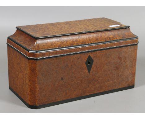 A Regency burr walnut fitted tea caddy banded in mahogany and with three internal boxes.