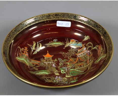 A Carltonware handpainted rouge Royale ribbed bowl under glazed in red and decorated with oriental scene.