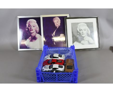 Three Marilyn Monroe prints and a collection of five Diecast model cars.