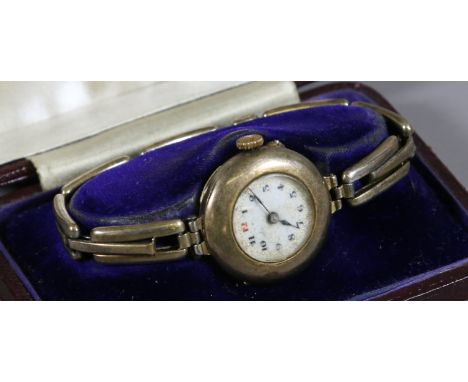 An imported silver bracelet watch with enamel dial. Assayed London 1917. 