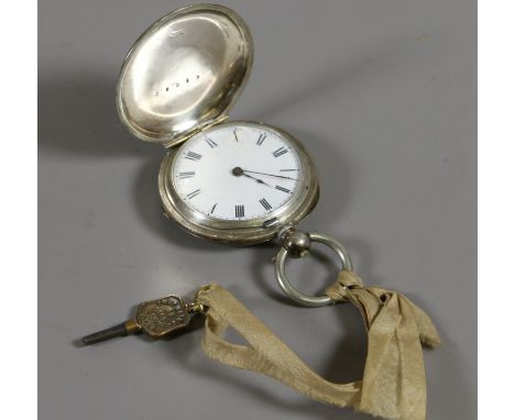 A silver cased full hunter fob watch with enamel dial and Roman numeral markers. 