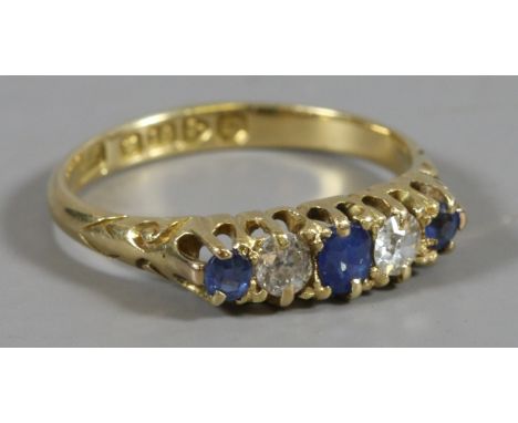 An Edwardian 18ct gold ring set with sapphires and diamonds, approximately 0.25ct total diamond weight. Assayed Chester 1904.