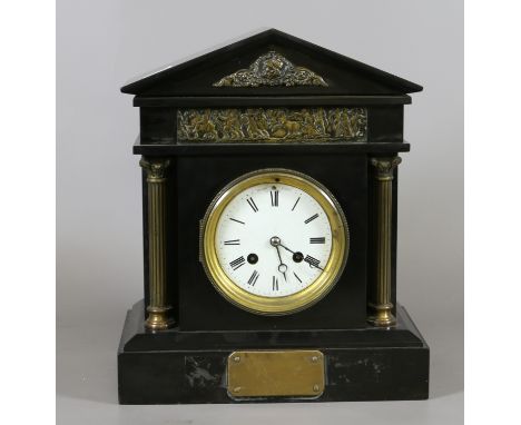 A Victorian slate mantel clock with classical frieze and fluted brass columns.