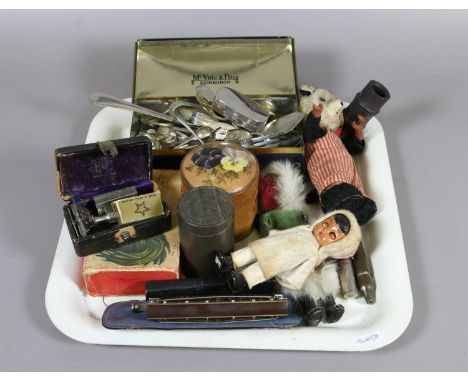 A tray of collectables including a harmonica, clockwork toy panda, silver plated cutlery and a cased cut throat razor