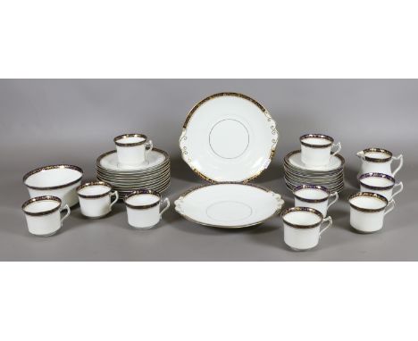 A 36 piece diamond china tea service decorated in blue and white with gilt edging 