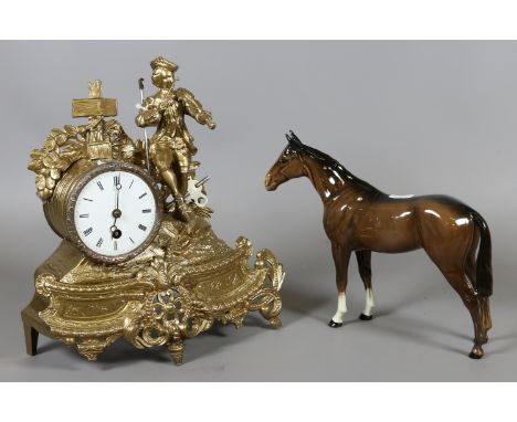 A French gilt spelter mantel clock and a Beswick model of a chestnut horse.