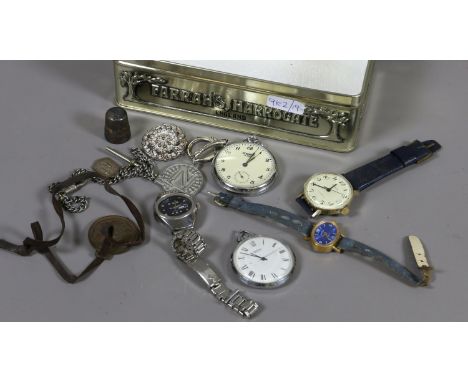 A tin of collectables, mostly watches including three Sekonda examples; two of pocket watch form, a Rubla manual watch etc.