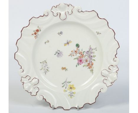 A 19th century Samson Chelsea silver shaped plate. With moulded rim edged in brown enamel and painted in the Duetsche Blumen 