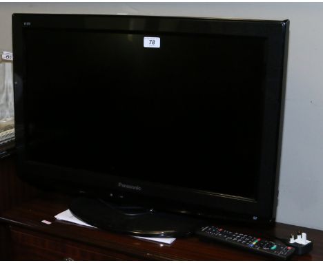 A Panasonic Viera television with remote and manual.