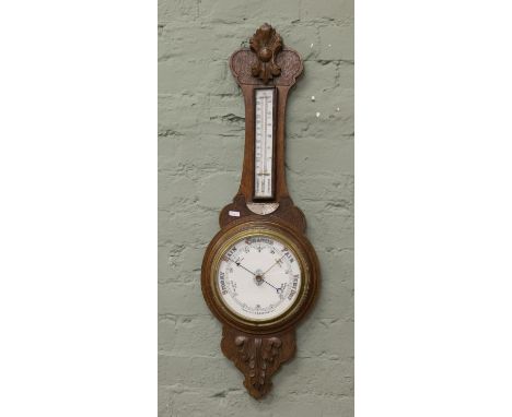 An early 20th century oak aneroid barometer 