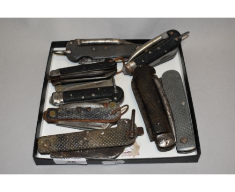 A collection of vintage pocket knives and multi tools, including guide knife.