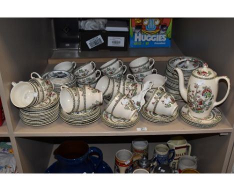 A large collection of Johnson Bros 'Indian Tree' cups, saucers, plates, coffeepot and bowls.