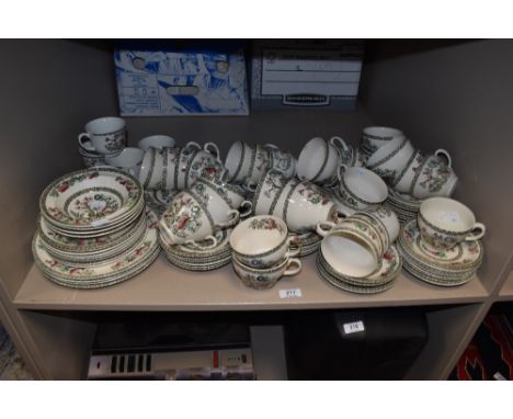 A large collection of Johnson Bros 'Indian Tree' cups, saucers, plates and bowls.