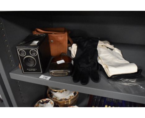 A Six-20 Brownie C camera, a Hip flask and four pairs of vintage and antique gloves, including full length cream kid gloves.