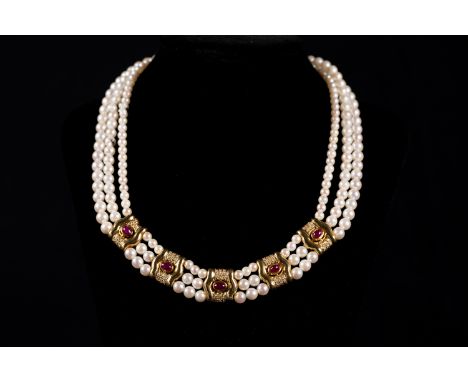Pearl Necklace in three lines with gold 585 with diamonds of 0,5 carat and rubies, akoya pearls .