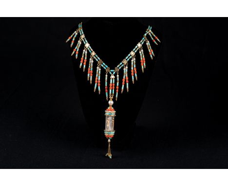 Gold necklace 18 carat with turquoise and corals pearls and a egyptomanian pendant.