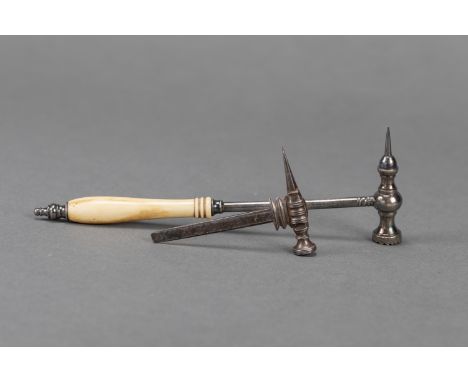 two miniature tools in form of hammers, I and Iron,