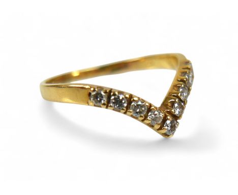 An 18ct yellow gold nine stone diamond wishbone ring, size P, weight 2.3g.