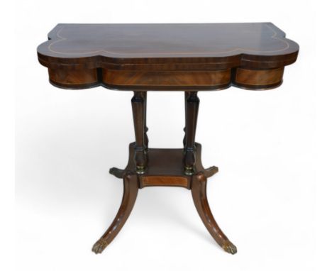 A Regency style mahogany card table, with a shaped folder top on a pillared platform base and out-swept legs, 87 by 44 by 79c