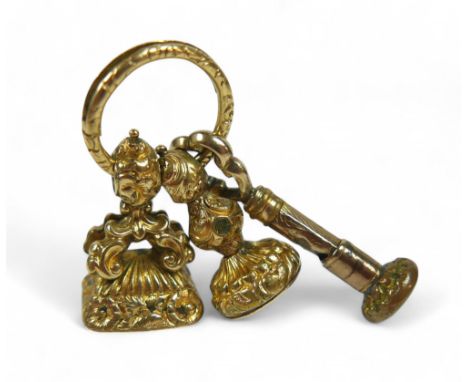 Three 19th century fob seals, comprising one gold-mounted set with black hardstone, engraved with a hand holding a tankard an