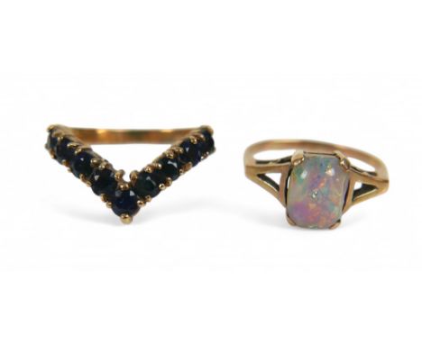 Two 9ct yellow gold rings, one set with an opal, size L, the other set with a sapphire, size O, combined weight 4.2g. (2)