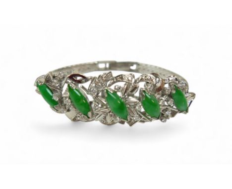 A jade, 18k white gold and diamond bracelet, set in the 1960's, the spray design with five marquise-cut jade central stones s