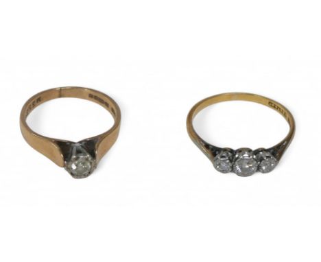 Two diamond rings, comprising an 18ct gold and platinum, three-stone ring, central stone approximately 3mm diameter, flanked 